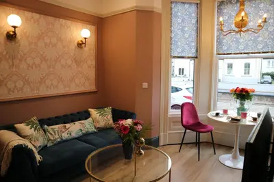 a living room with a couch and a table at No 9 The Folly in Southport