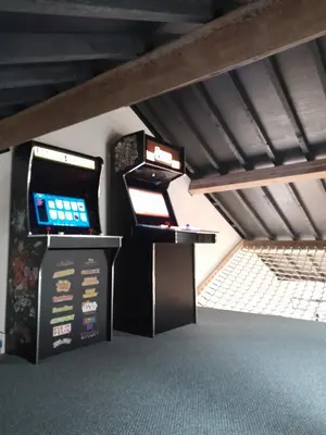 two arcade video game machines in a room at The Eden Warehouse - Gold Apartment, sleeps 6 in Southport