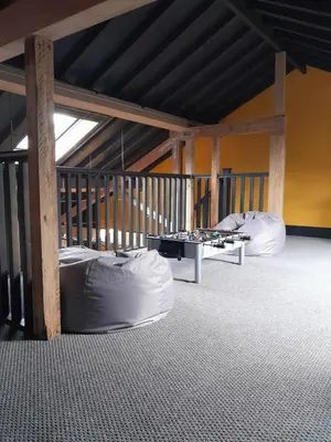 two bean bag chairs and a table in a room at The Eden Warehouse - Gold Apartment, sleeps 6 in Southport