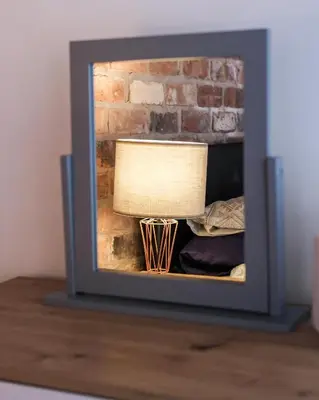 a lamp in front of a brick fireplace at The Eden Warehouse - Green Apartment, sleeps 5 in Southport