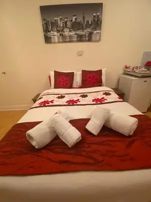 a bedroom with a bed with two towels on it at Mellory hotel in Blackpool