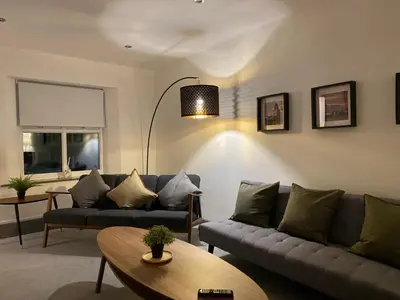 a living room with a couch and a table at Spacious City Centre Property in Lancaster