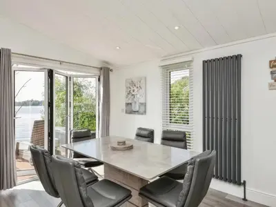 a dining room with a table and chairs at Gerrida Lodge in Carnforth