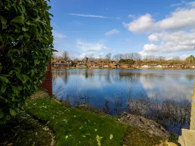 a view of a large lake with houses at Gerrida Lodge in Carnforth