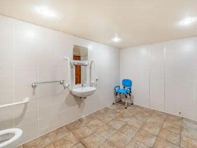 a bathroom with a sink and a toilet at The Barn in Poulton le Fylde