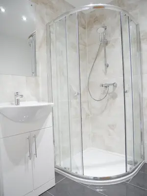 a bathroom with a shower and a sink at The Ravens Inn, 4 - Bed, Sleeps 6, Pets Welcome in Ulverston