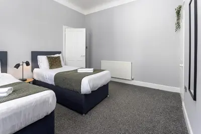 a hotel room with two beds in a room at Arkles House - Air Host & Stay - Anfield in Liverpool