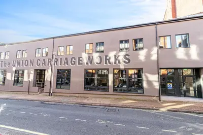 a building with a sign that reads the union cartridge novels at Carriage Works by Guestz in Preston
