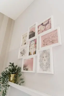 a bunch of pictures hanging on a wall at Prime Suites Lytham in Lytham St Annes