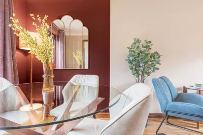 a dining room with a glass table and chairs at Gorgeous Cottage near Cartmel with FREE SPA Access in Holker