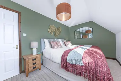 a bedroom with a bed and a ceiling at Gorgeous Cottage near Cartmel with FREE SPA Access in Holker