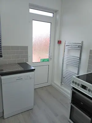 a kitchen with a window and a counter top at St Annes Lodge Apartments, Lytham St Annes in Lytham St Annes