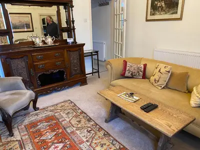 a living room with a couch and a table at Number 19 - Victorian Town House in Clitheroe