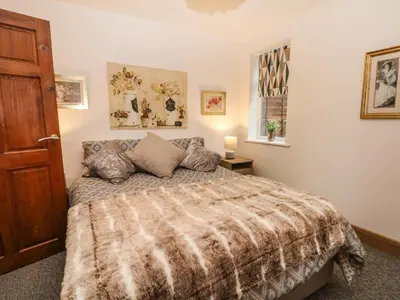 a bedroom with a bed and a window at Bella Vita in Southport