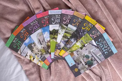 a pile of magazines sitting on top of a bed at Ribble Valley Retreat in Langho