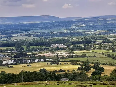 a view of a green field with animals in the distance at The View - Uk36812 in Whalley