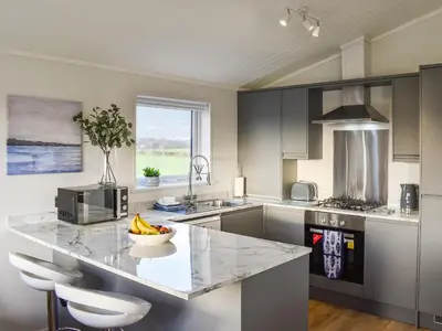 a kitchen with a counter with a bowl of bananas on it at The View - Uk36812 in Whalley