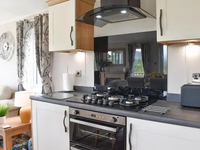a kitchen with a stove top oven in a room at Lake View - Uk36811 in Whalley
