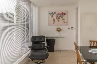 an office with a desk and a chair in a room at Sidemersey Livings- Unmatched Panoramic Views, Secure Parking, Beautiful Balcony- A Stay to Remember in Liverpool