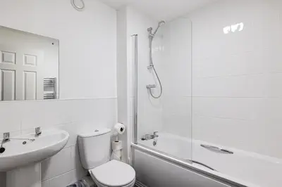 a bathroom with a toilet and a sink and a shower at Stanley Sparkle Stays - 4BRooms, 4Beds, Prkg, Wifi in Liverpool