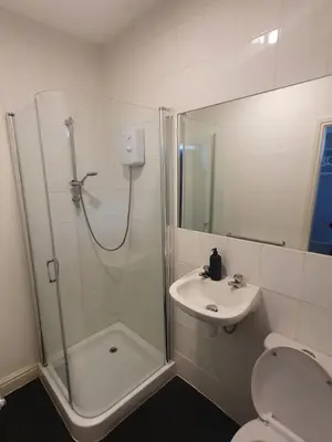 a bathroom with a shower and a toilet and a sink at Blackpool North Close to Station - With Free Car Parking in Blackpool