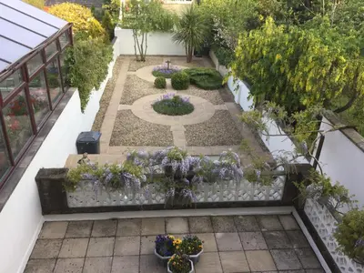 an overhead view of a garden with flowers and plants at Eden Vale Garden View Apartment with Patio in Morecambe