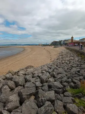 a large group of rocks on a beach at Eden Vale Garden View Apartment with Patio in Morecambe