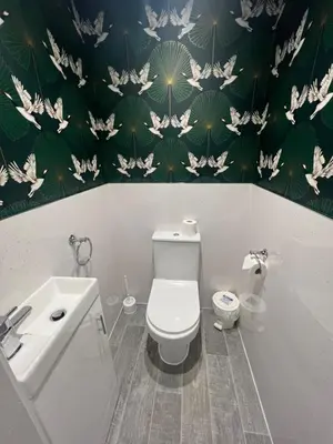 a bathroom with a toilet and a sink at Eden Vale Garden View Apartment with Patio in Morecambe