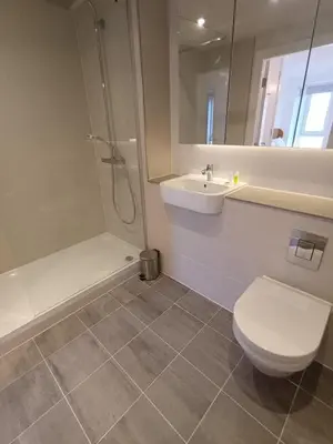 a bathroom with a toilet and a sink and a shower at Copper House in Liverpool in Liverpool