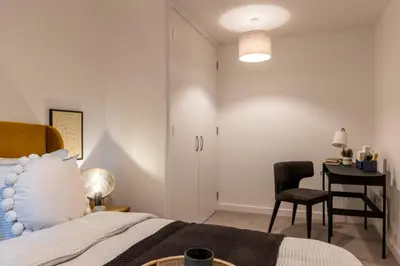 a bedroom with a bed and a desk and a chair at Copper House in Liverpool in Liverpool