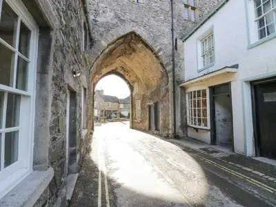 an archway in an alleyway between two buildings at 1 Tower House in Grange Over Sands