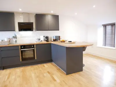 a kitchen with a island in the middle at Scandic House, 1 Bed Apartments, Sleeps 2, Ulverston in Ulverston