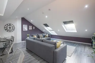 a living room with a couch and a table at Charles Alexander Short Stay - The Gateway in Blackpool