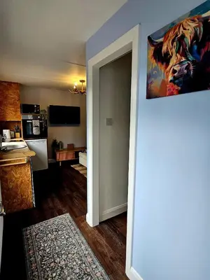 an open door to a kitchen with at The Woodland Lodge - Wood Fired Hot Tub and Firepit in Hambleton