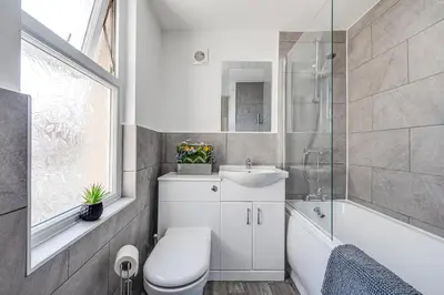a bathroom with a toilet and a sink and a shower at Ursula Sparkle Stays in Liverpool