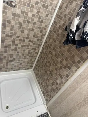 a shower stall with a sink in a bathroom at The Clarendon Hotel in Blackpool