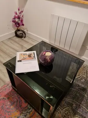 a glass table with a vase on top of it at 1 Bedroom Swinley Apartment l Free Parking l Wigan Royal Infirmary l Haigh Hall l Central Location in Wigan