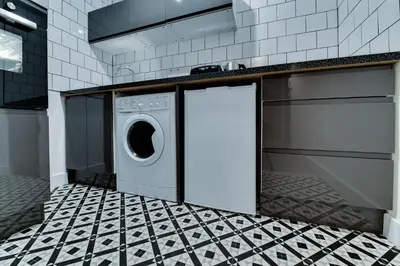 a kitchen with a washer and dryer in a kitchen at 1 Bedroom Swinley Apartment l Free Parking l Wigan Royal Infirmary l Haigh Hall l Central Location in Wigan
