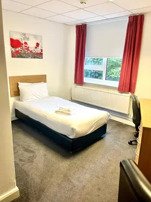 a bedroom with a bed and a window at Lancaster University in Lancaster