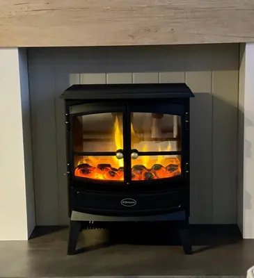 a stove with a fire inside of a room at 5 Lake View, Barrow, Clitheroe - in the heart of the Ribble Valley in Pendleton
