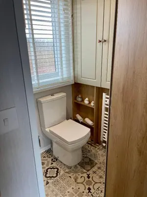 a bathroom with a white toilet and a window at 5 Lake View, Barrow, Clitheroe - in the heart of the Ribble Valley in Pendleton