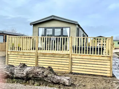 a wooden fence in front of a house at 5 Lake View, Barrow, Clitheroe - in the heart of the Ribble Valley in Pendleton
