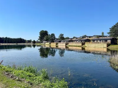 a river with houses on the side of it at 5 Lake View, Barrow, Clitheroe - in the heart of the Ribble Valley in Pendleton