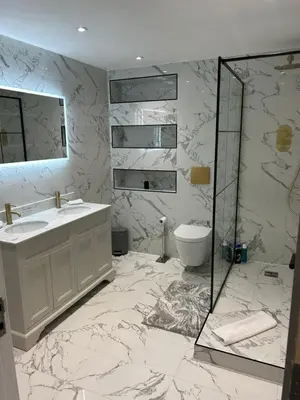 a white bathroom with a sink and a shower at NOVU Apartments Duke Street Liverpool in Liverpool