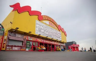 a fast food restaurant with a large yellow and red building at Withnell Stays - Apartment Two in Blackpool