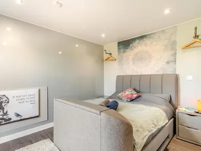 a bedroom with a bed and a couch in it at Pendle View Lodge in Altham