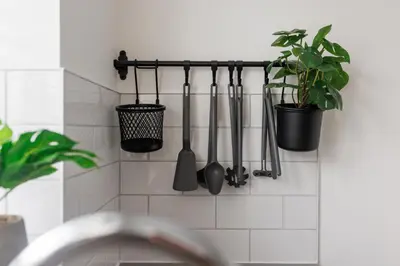 a kitchen with utensils hanging on a wall at Everton Valley House - Air Host & Stay - Close to city centre in Liverpool