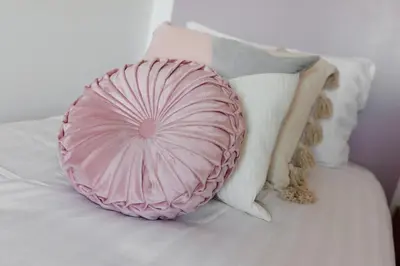 a pink pillow sitting on a bed with pillows at Everton Valley House - Air Host & Stay - Close to city centre in Liverpool