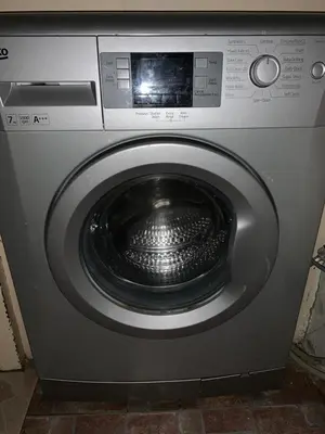 a silver washing machine with a bowl in the door at House - Sleeps 5 - Pet friendly - Garden - Parking in Saint Annes on the Sea