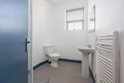 a bathroom with a toilet and a sink at Blackpool Lodge Apartments in Blackpool